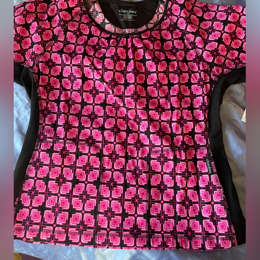 Pink and black womens size xl scrub top. Never worn still has manufacturer tag